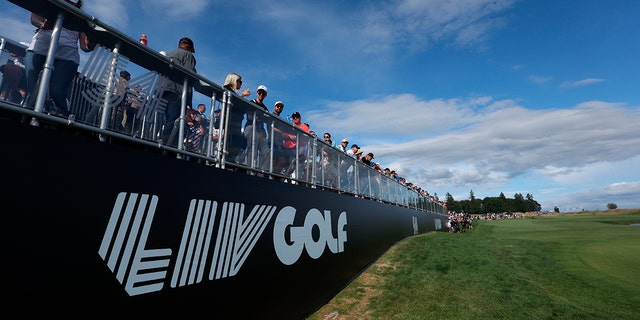 Fans await the final grouping at the 18th hole during the third round of the Portland Invitational LIV Golf tournament in North Plains, Ore., Saturday, July 2, 2022.