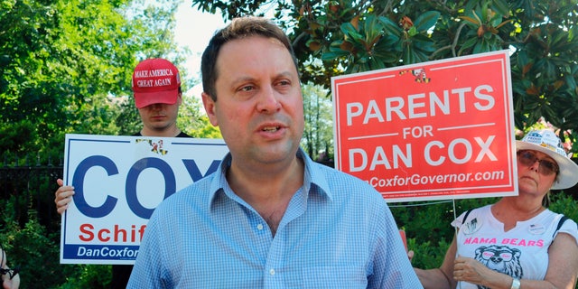 Del. Dan Cox, a Maryland state legislator who is seeking the Republican nomination for governor of Maryland, talks to reporters, in Annapolis, Md., Thursday, June 30, 2022