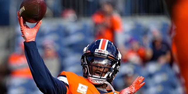 Denver Broncos quarterback Teddy Bridgewater, #5, warms up prior to an NFL football game against the Philadelphia Eagles, Sunday, Nov. 14, 2021, in Denver.