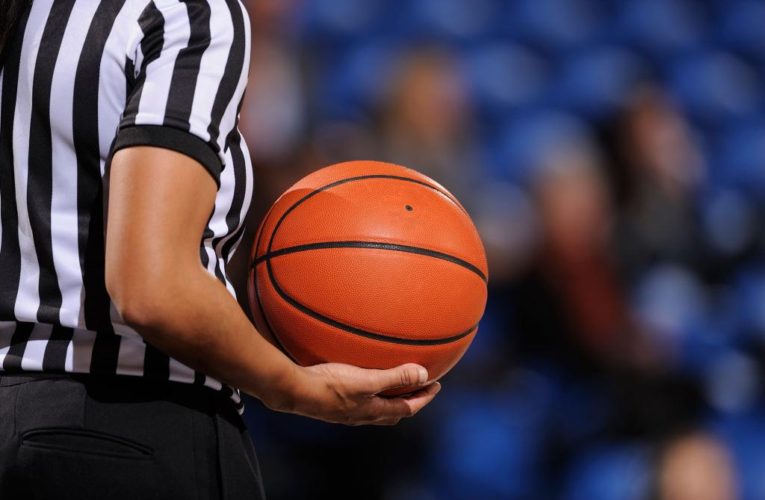 Youth basketball ref flattens fan with blindside punch