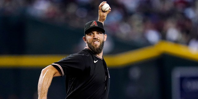 Arizona Diamondbacks starting pitcher Madison Bumgarner throws to a Washington Nationals batter during the third inning of a game Saturday, July 23, 2022, in Phoenix.