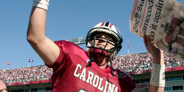 FILE - South Carolina quarterback Phil Petty (14) celebrates after defeating Ohio State, 31-28, in the Outback Bowl, Jan. 1, 2002, in Tampa, Florida.