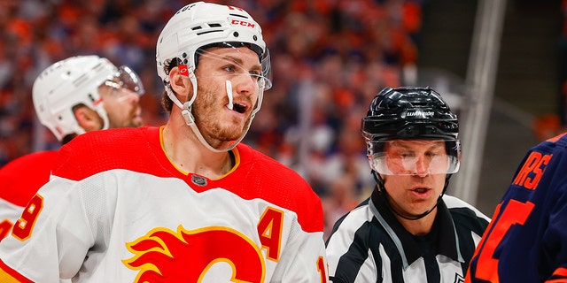 Calgary Flames Right Wing Matthew Tkachuk (19) gets pulled out of scrum action in the first period during the Edmonton Oilers versus the Calgary Flames in the Stanley Cup playoffs round 2, game 4 on May 24, 2022 at Rogers Place in Edmonton, AB.