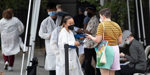 People wait to receive the Monkeypox vaccine at a mass vaccination site in Manhattan on July 26, 2022 in New York City. 