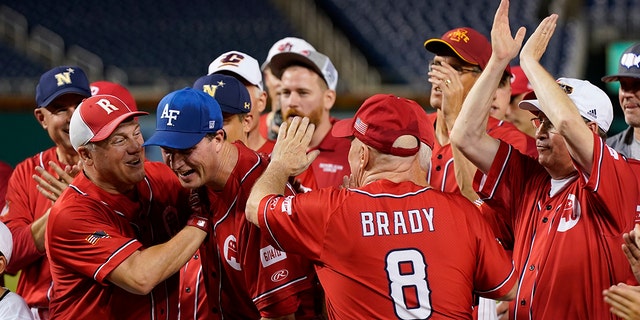 House Minority Whip Steve Scalise, R-La., left, and Rep. Kevin Brady, R-Texas, congratulate Rep. August Pfluger, R-Texas, after Pfluger was named the most valuable player of the Congressional Republican team after the Congressional Baseball Game in Washington, D.C., on Thursday, July 28, 2022.