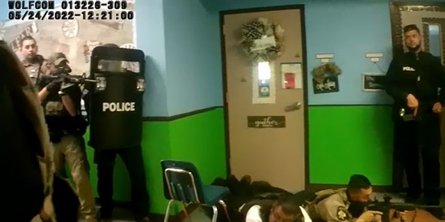 Uvalde police officers and other law enforcement officers are seen responding to a mass shooting at Robb Elementary School in Uvalde, Texas, in a bodycam video recorded on May 24, 2022. 