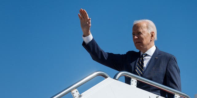 President Joe Biden waves as he boards Air Force One for travel to Philadelphia from Joint Base Andrews, Maryland, U.S. March 11, 2022. 