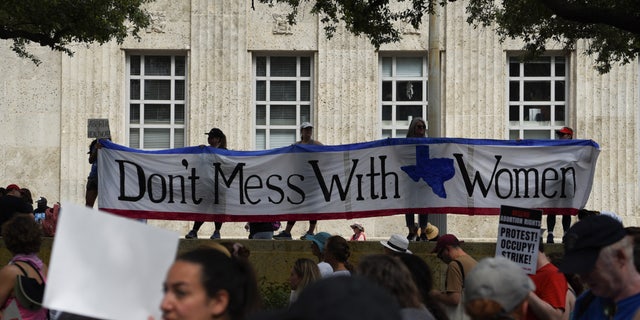 Abortion rights protesters participate in nationwide demonstrations following the leaked Supreme Court opinion suggesting the possibility of overturning the Roe v. Wade abortion rights decision, in Houston, Texas, U.S., May 14, 2022. 