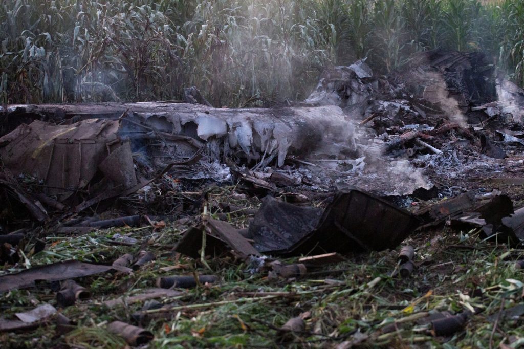 Debris is seen at the crash site of an Antonov An-12 cargo plane owned by a Ukrainian company, near Kavala, Greece, July 17, 2022.