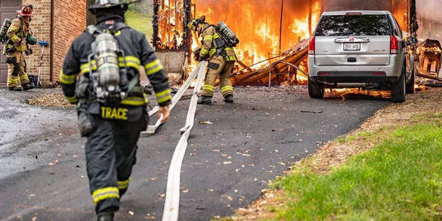 Janesville Fire Department Firefighters respond to a fire on July 17, 2022