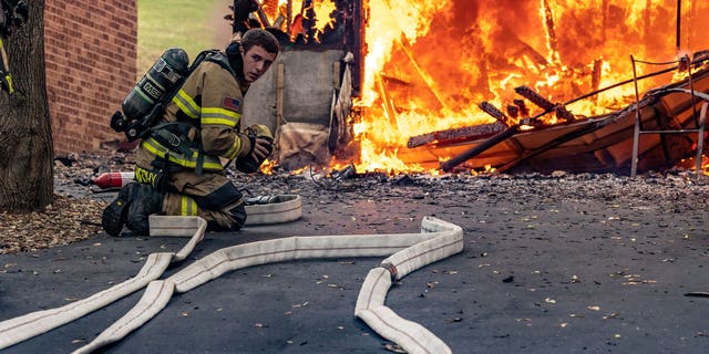 Janesville Fire Department Firefighters respond to a house fire on July 17, 2022