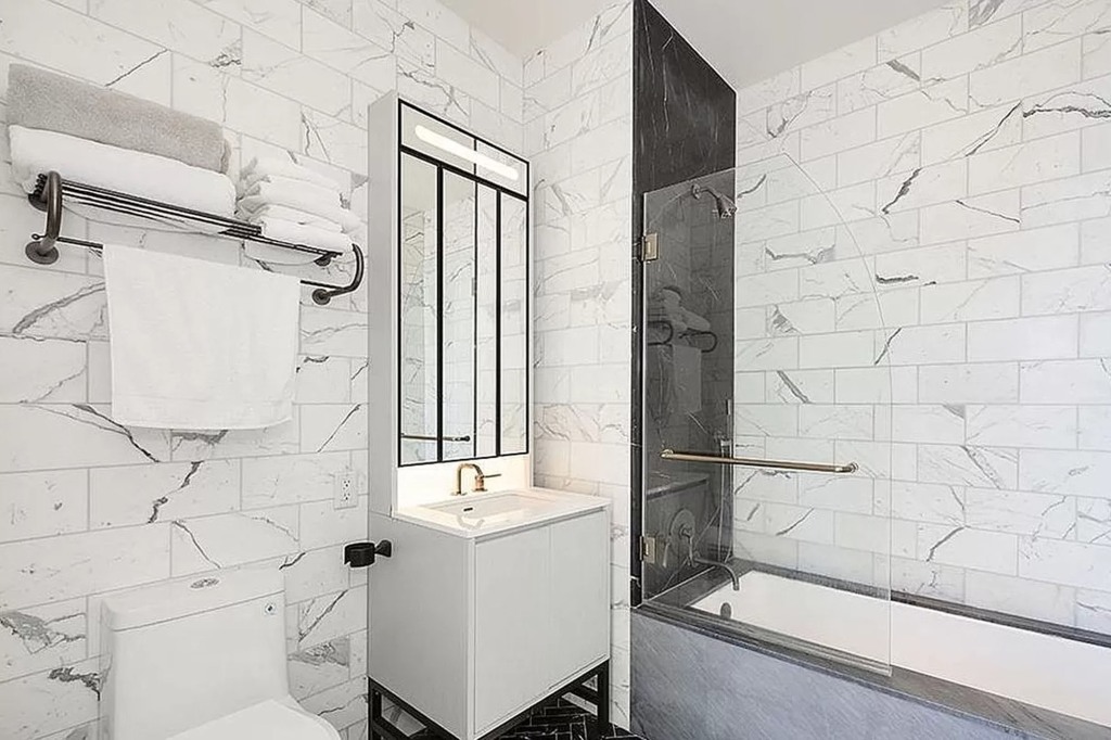 The marble-tiled bathroom.