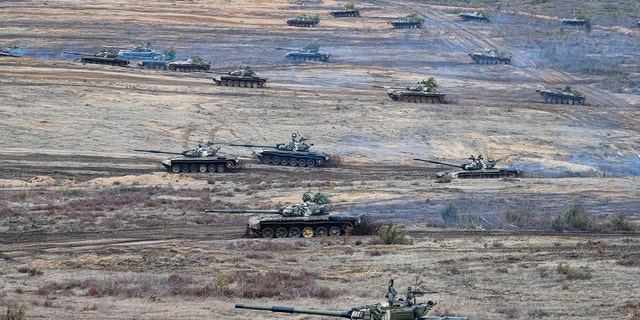 Tanks move during the Union Courage-2022 Russia-Belarus military drills at the Obuz-Lesnovsky training ground in Belarus, Saturday, Feb. 19, 2022. Russia has deployed troops to its ally Belarus for sweeping joint military drills that run through Sunday, fueling Western concerns that Moscow could use the exercise to attack Ukraine from the north. 