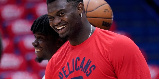 FILE - New Orleans Pelicans forward Zion Williamson watches a shoot-around before Game 6 of the team's NBA basketball first-round playoff series against the Phoenix Suns, April 29, 2022, in New Orleans. Two people familiar with the decision say Williamson has agreed to a five-year extension worth $193 million. The people spoke to The Associated Press on condition of anonymity because NBA rules do not allow the extension to become official until July 6. (AP Photo/Gerald Herbert, File)