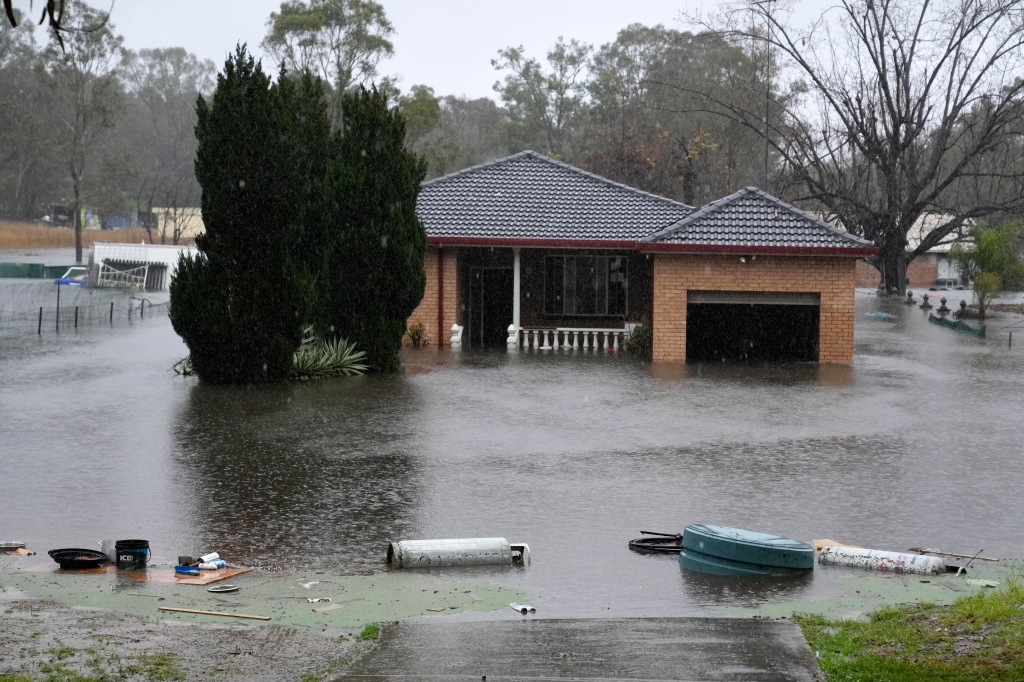 A house sits semi-submerged in flood waters near Richmond on the outskirts of Sydney, Australia.