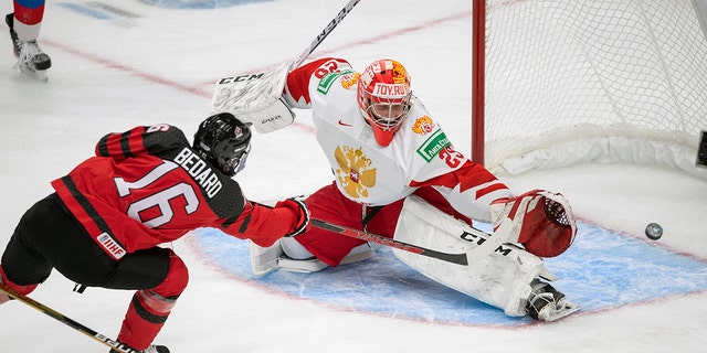 Canada's Connor Bedard (16) scores on Russia goalie Yegor Guskov (29) during the third period of an exhibition hockey game in Edmonton, Alberta, Thursday, Dec. 23, 2021, before the IIHF World Junior Hockey Championship tournament. Yegor Guskov is one of several Russian goaltenders eligible to be taken in the 2022 NHL draft. 