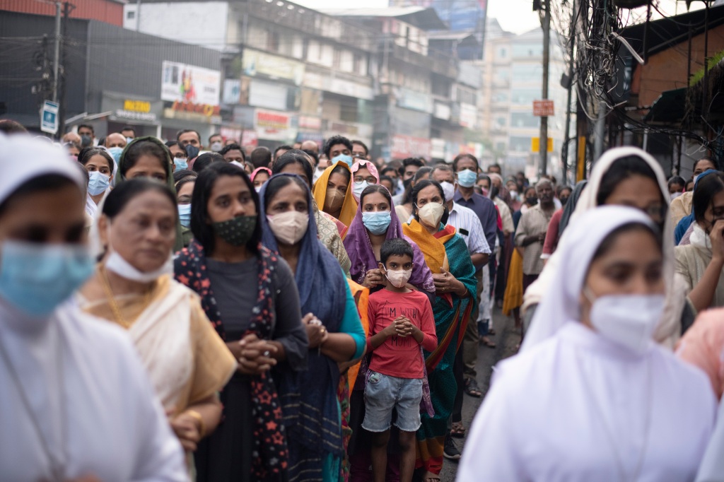 Indian Christians wearing masks as a precaution against COVID-19 gather for prayers in Kerala state, India, on April 10, 2022. 