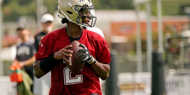 New Orleans Saints quarterback Jameis Winston, #2, drops back to pass during the NFL football team's training camp in Metairie, La., Wednesday, July 27, 2022. 