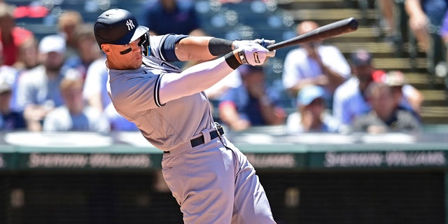 New York Yankees' Aaron Judge hits a double in the sixth inning in the first baseball game of a doubleheader against the Cleveland Guardians, Saturday, July 2, 2022, in Cleveland.