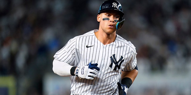 New York Yankees' Aaron Judge runs the bases after hitting a home run against the Boston Red Sox during the sixth inning of a baseball game Saturday, July 16, 2022, in New York.