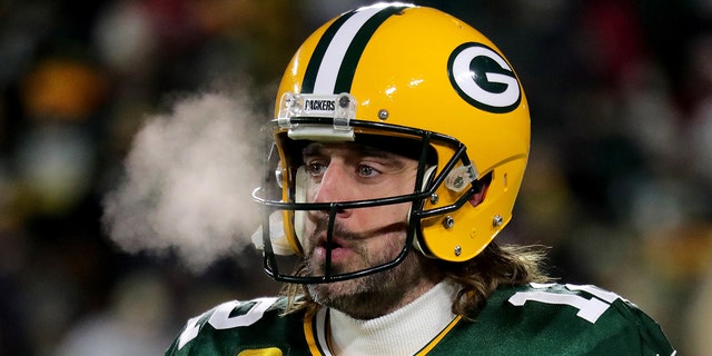 Jan 22, 2022; Green Bay, Wisconsin, USA; Green Bay Packers quarterback Aaron Rodgers (12) warms up before the Green Bay Packers divisional playoff game against the San Francisco 49ers at Lambeau Field.