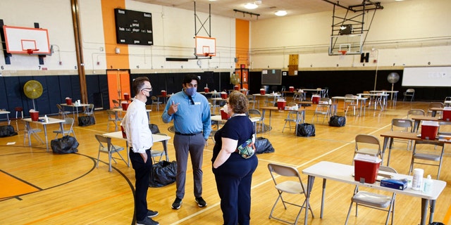 Commissioner Ashwin Vasan speaks to health care workers before the opening of a monkeypox mass vaccination site at the Bushwick Education Campus in Brooklyn on July 17, 2022.