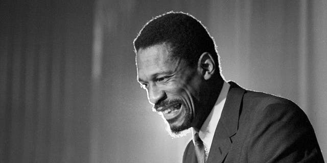 Bill Russell smiles following the announcement that he had been named coach of the Boston Celtics on April 18, 1966.