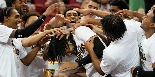 Portland Trail Blazers celebrate after defeating the New York Knicks in an NBA summer league championship basketball game Sunday, July 17, 2022, in Las Vegas. 