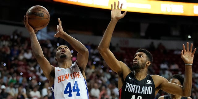 New York Knicks' Feron Hunt shoots against Portland Trail Blazers' Kyle Alexander during the first half an NBA summer league championship basketball game Sunday, July 17, 2022, in Las Vegas. 