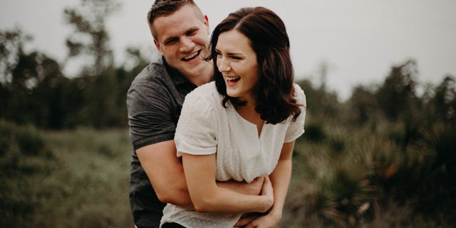 Jared and Kirsten Bridegan pose for an engagement photo.