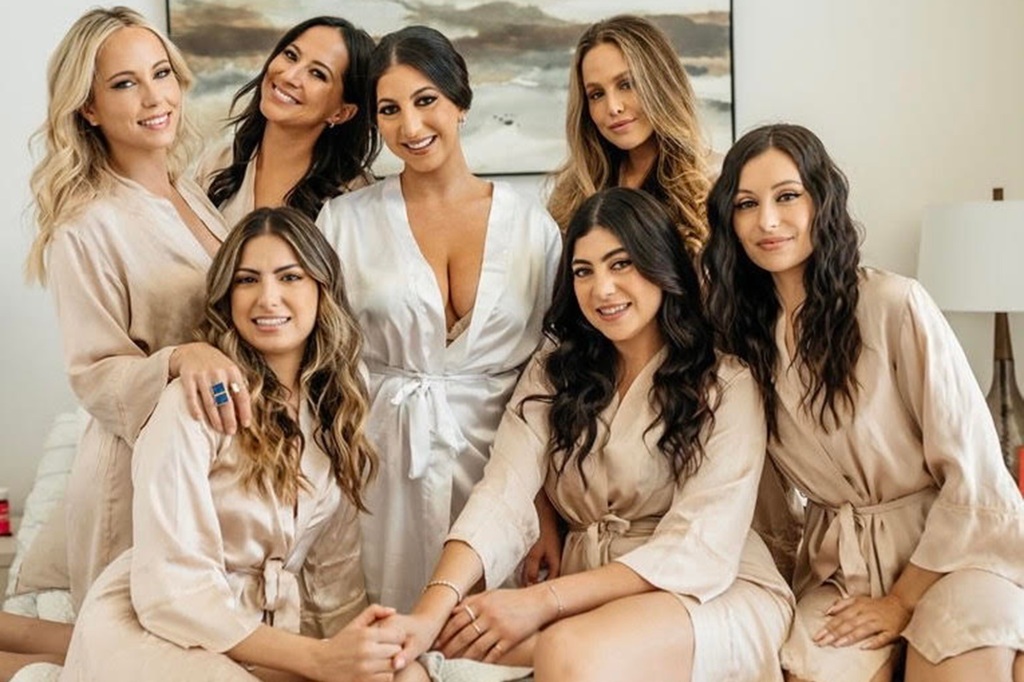 Robert and her bridesmaids pose in their free robes, valued at a little over $1,000. 