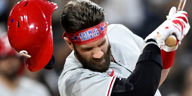 Bryce Harper #3 of the Philadelphia Phillies is hit with a pitch during the fourth inning of a baseball game against the San Diego Padres June 25, 2022 at Petco Park in San Diego, California.