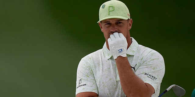 Bryson DeChambeau waits to take his shot during the Masters on April 8, 2022, in Augusta, Georgia.