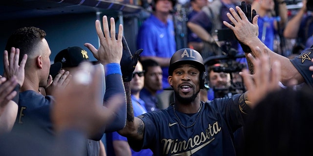 American League's Byron Buxton, of the Minnesota Twins, celebrates in the dugout after hitting a solo home run during the fourth inning of the MLB All-Star baseball game against the National League, Tuesday, July 19, 2022, in Los Angeles.