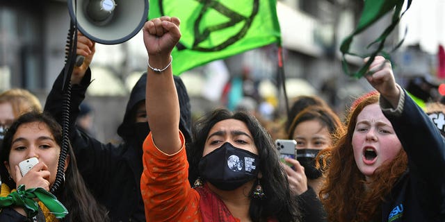 Climate activists demonstrate outside the U.N. climate conference in Glasgow, Scotland, Nov. 12, 2021.