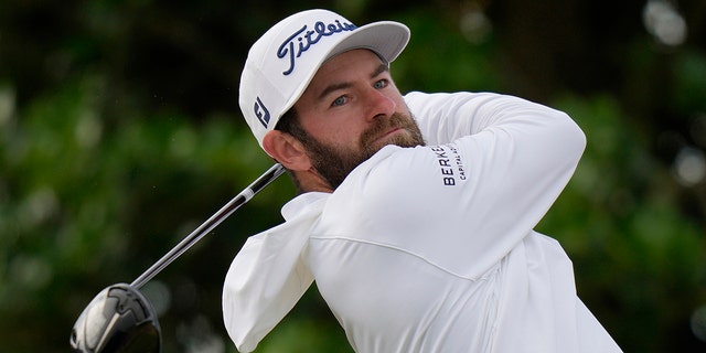 Cameron Young of the US plays from the 3rd tee during the first round of the British Open golf championship on the Old Course at St. Andrews, Scotland, Thursday, July 14 2022.