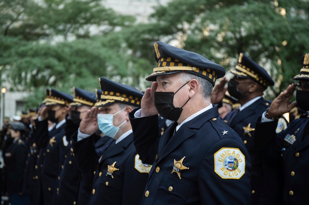 Members of the Chicago Police Department salute during the commemoration of the 20th anniversary of the Sept. 11 attacks at the Richard J. Daley Plaza in the Loop in Chicago in 2021.