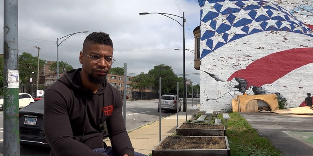 Assistant pastor TJ Groom sits outside of New Beginnings Church in the South Side of Chicago. (Fox News Digital/Lisa Bennatan)