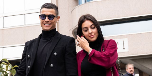 Portuguese soccer player Cristiano Ronaldo leaves from the provincial court of Madrid with his girlfriend Georgina Rodriguez from his tax evasion trial.