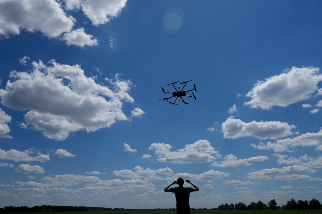 Oleg flies a drone while testing it on the outskirts of Kyiv, Ukraine, Wednesday, June 8, 2022. 