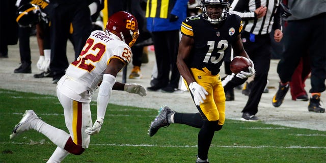 James Washington #13 of the Pittsburgh Steelers in action against Deshazor Everett #22 of the Washington Football Team on December 8, 2020 at Heinz Field in Pittsburgh, Pennsylvania.  