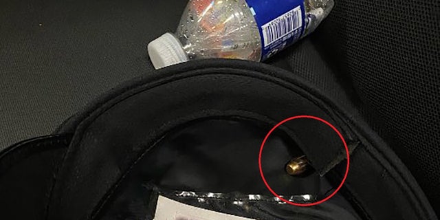 A photo shows a bullet lodged in the blood stained hat worn by a Philadelphia police officer who was shot in the head on July 4, 2022.
