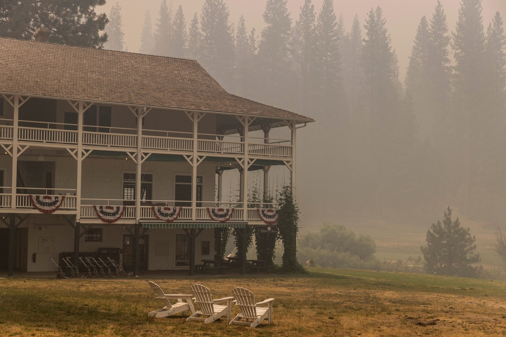 The Wawona Hotel, undamaged from the Washburn Fire, is seen under a smoke-filled sky in Yosemite National Park, Calif. Monday, July 11, 2022.