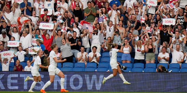 England's Georgia Stanway, right, celebrates after scoring the opening goal from the penalty spot during the Women Euro 2022 group A soccer match between England and Norway at Brighton &amp;amp; Hove Community Stadium in Brighton, England, Monday, July 11, 2022. 