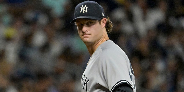 New York Yankees starter Gerrit Cole checks a baserunner during the fifth inning of a baseball game against the Tampa Bay Rays, Monday, June 20, 2022, in St. Petersburg, Fla. 