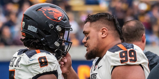 Oregon State Beavers defensive lineman Elu Aydon (99) congratulates Oregon State Beavers linebacker Hamilcar Rashed Jr. (9) after the closing play in the game between the Oregon State Beavers and the California Golden Bears on Saturday, October 19, 2019 at Memorial Stadium in Berkeley, California.