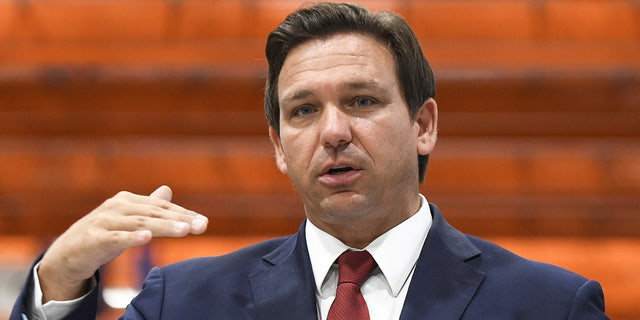 Florida Gov. Ron DeSantis speaks at a press conference at LifeScience Logistics in 2021.