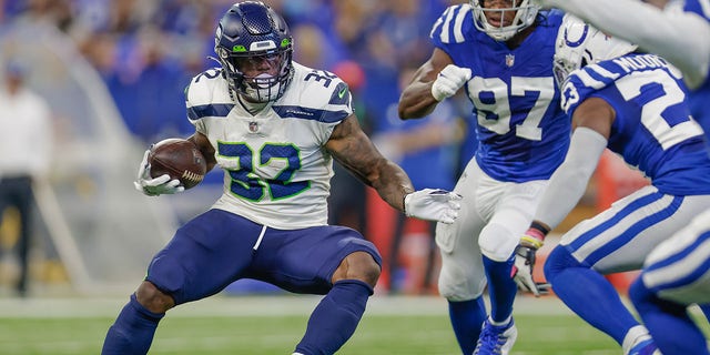 Chris Carson #32 of the Seattle Seahawks runs the ball during the game against the Indianapolis Colts at Lucas Oil Stadium on Sept. 12, 2021 in Indianapolis, Indiana. 