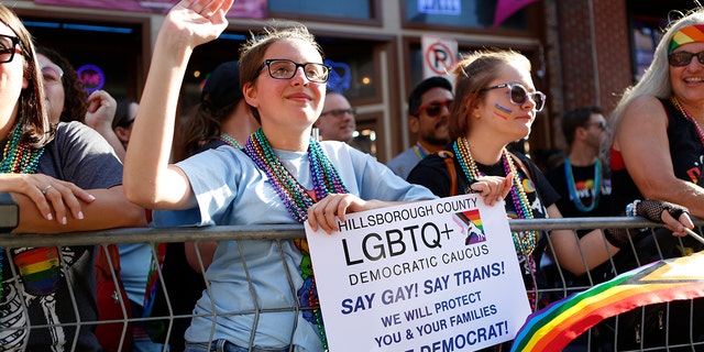 TAMPA, FL - MARCH 26: Revelers celebrate on 7th Avenue during the Tampa Pride Parade in the Ybor City neighborhood on March 26, 2022 in Tampa, Florida. (Octavio Jones/Getty Images)