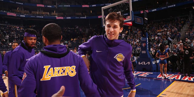 Austin Reaves of the Los Angeles Lakers smiles before a game against the Golden State Warriors April 7, 2022, at Chase Center in San Francisco. 